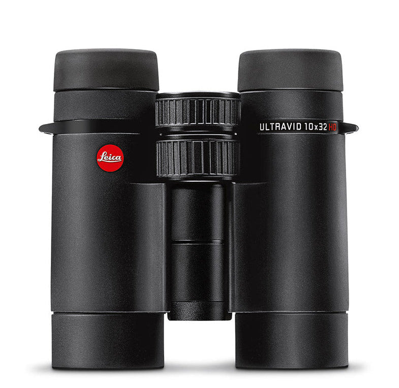 A pair of Leica Ultravid 10x32 HD-Plus binoculars, black in color, with visible brand logo, placed upright.